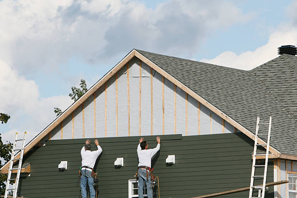 Professional Storm Damage Siding Repair technician working in West Columbia, TX